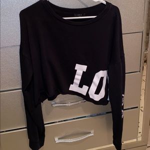 It’s a crop top in the side says love